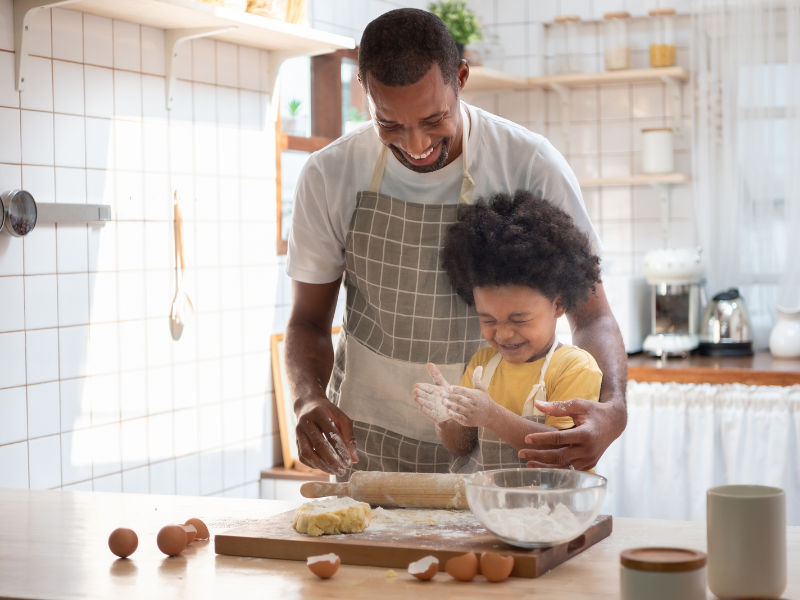 dad and child baking together